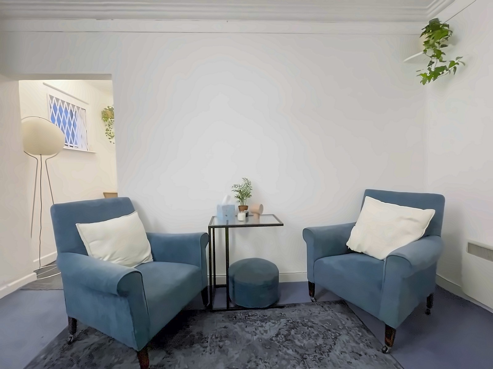 Two consulting armchairs and a small table