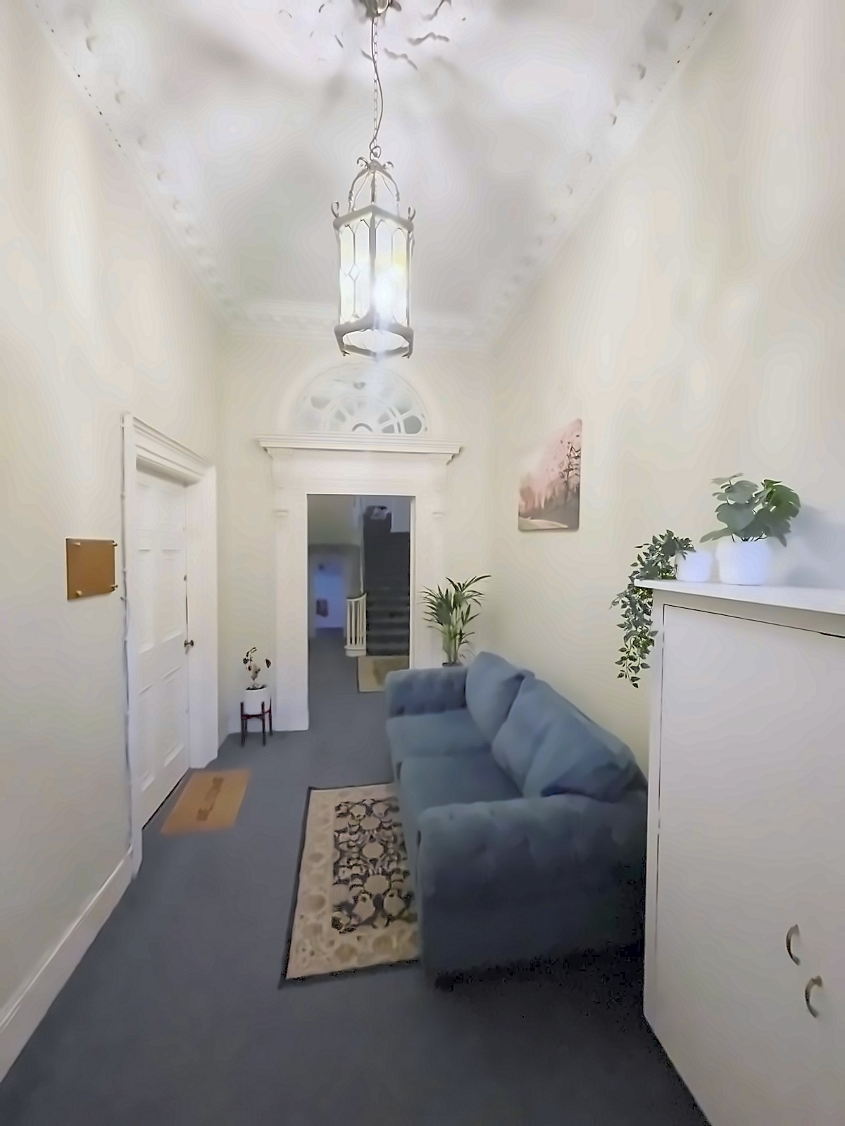 The entrance hallway with its original ceiling